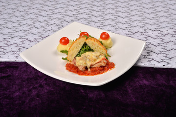 pork rind cheese with tomato and pepper sauce, mashed potatoes,
