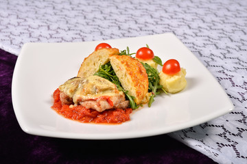 pork rind cheese with tomato and pepper sauce, mashed potatoes,