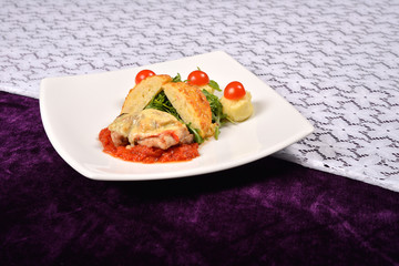 pork rind cheese with tomato and pepper sauce, mashed potatoes,