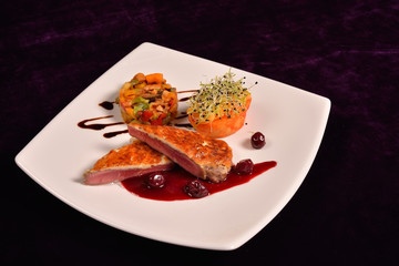 duck breast in parmesan crust, cranberry sauce and a ratatuille