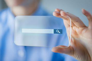 close up of woman with transparent smartphone