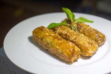 Nem - homemade spring rolls with chili sauce and fresh coriander - vietnamese cuisine