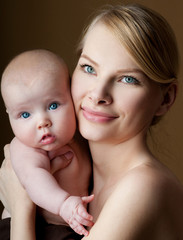 Young mother with a charming baby.Happy family. Mom's love and t