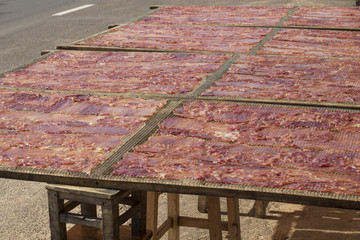 Sliced sheets of dried and crispy pork 
Or sun dride pork. (Thai food) 