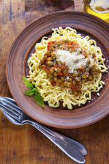 Homemade Fresh Italian Pasta with a sauce of green Peas and Toma