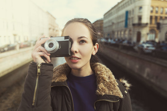 Tourist Hipster Girl Making Photo With Retro Camera
