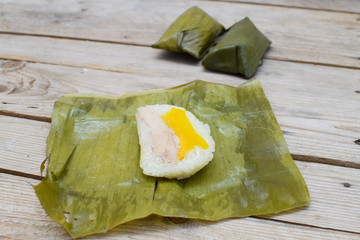 Steamed sticky rice wrapped by banana leaf, Thai dessert, Khao Tom Mad in Thai words