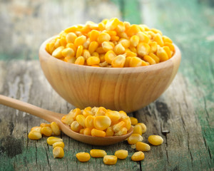 corn in the wood bowl on wooden