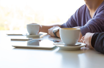 Hands of Young Man and Woman at Cafe Table Side View