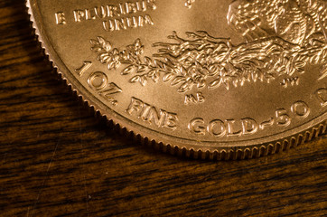 1 oz. Fine Gold (words) on US Gold Eagle Coin
