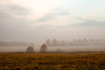 Fototapeta premium Tractor in fog