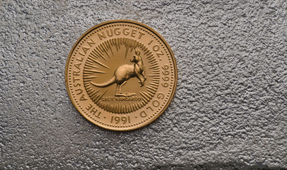 Australian Gold Nugget Coin on Silver Bar
