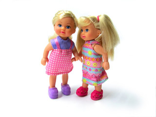 Fototapeta na wymiar two nice dolls-friends on white background