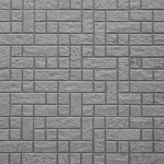Black brick wall tile seamless background and texture