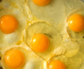 pan full of scramble eggs in a frying pan