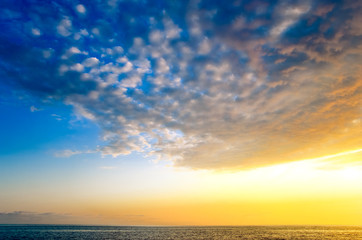 Beautiful cloudy sunset on the beach