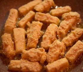 breaded cheese on a pan