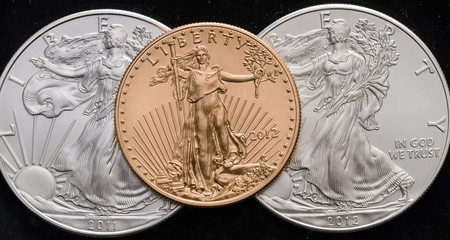 US Gold Eagle on 2 US Silver Eagles w/ Black background