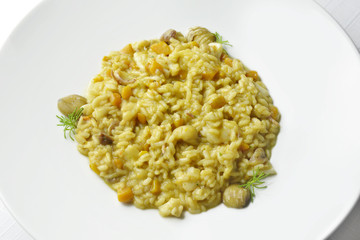 Risotto with sea delicacies pumpkin and chestnuts