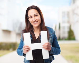 woman holding the H letter