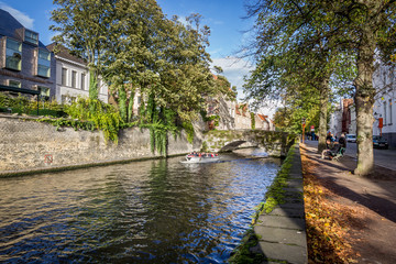 Fototapeta na wymiar Old brick buildings and bridges in Flemish city Bruges. Flanders, Belgium