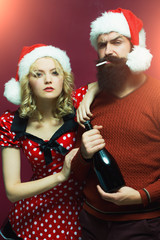 Christmas couple with bottle and cigarette