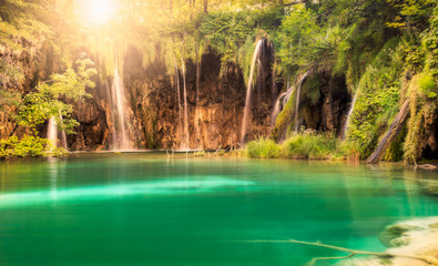 Waterfall with sun at Plitvice Lakes National Park, Croatia
