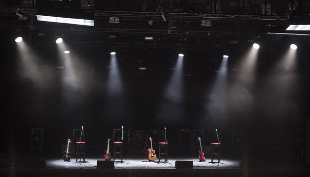 Guitar and other musical equipment on stage before concert