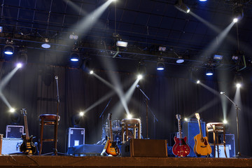 Guitar and other musical equipment on stage before concert