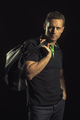 Strong muscular man with bag