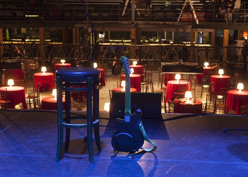 Guitar and other musical equipment on stage before concert