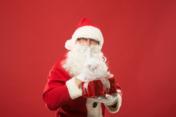 Portrait of happy Santa Claus with a huge sack