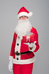 Portrait of happy Santa Claus with a huge sack