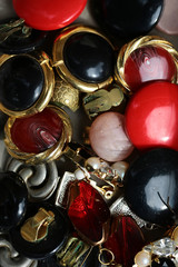 Old-fashioned used earclips piled together © Volodymyr
