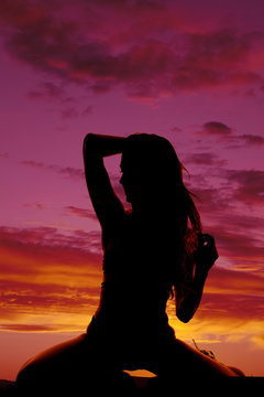 silhouette woman in bikini kneel low