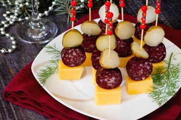 Zelfklevend Fotobehang Canape with cheese, potatoes and smoked sausage on a wooden tabl © elena_hramowa