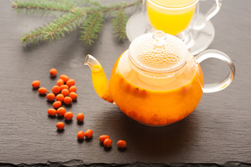 Fototapeta na wymiar Tea with sea-buckthorn berries and honey