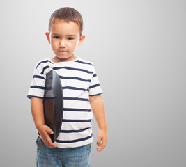 portrait of a little boy holding a vinyl record