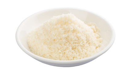 Grated cheese in a white bowl over white background - 93643536