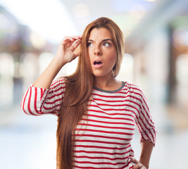 Fototapeta premium portrait of a worried young woman with a pensive gesture