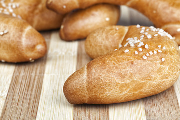 Macro photo of fresh homemade rolls. Studio shot, Photographed on wooden table.