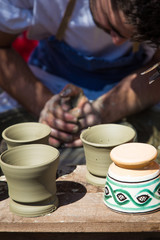 Potter hands creating a new cups