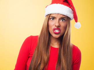 portrait of a beautiful young woman at Christmas with angry gesture