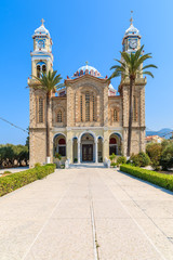 Fototapeta na wymiar Square with beautiful old church in Karlovasi town, Samos island, Greece