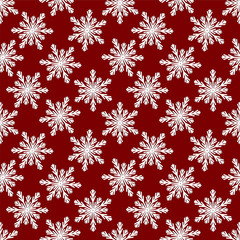 Christmas seamless pattern from white snowflakes on red backgrou