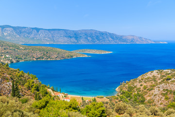 Fototapeta na wymiar View of beautiful bay with beach and houses on coast of Samos island, Greece