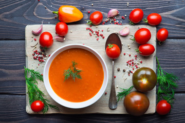 Tomato soup on a wooden table