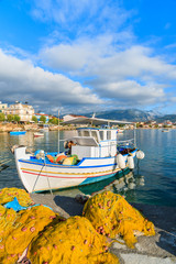 Greek fishing boat in sunrise light, Samos island, Greece