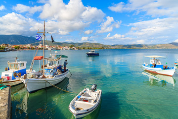 Fototapeta na wymiar Greek fishing boat mooring in port on Samos island, Greece.