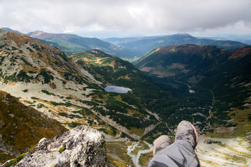 man looking from Ostry Rohac peak
